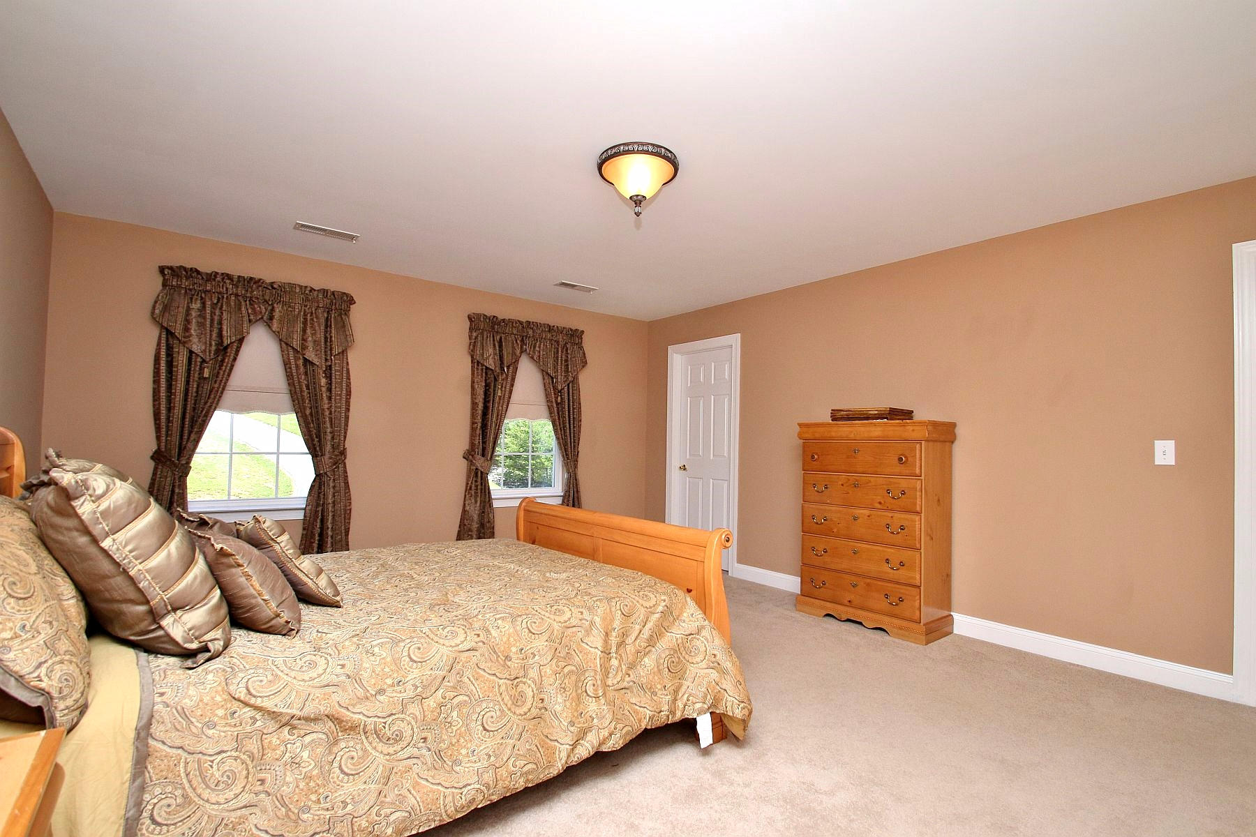 10 Old Point Road Moneta, VA 24121 - Photo 37 of 79 a bedroom with a bed and a dresser