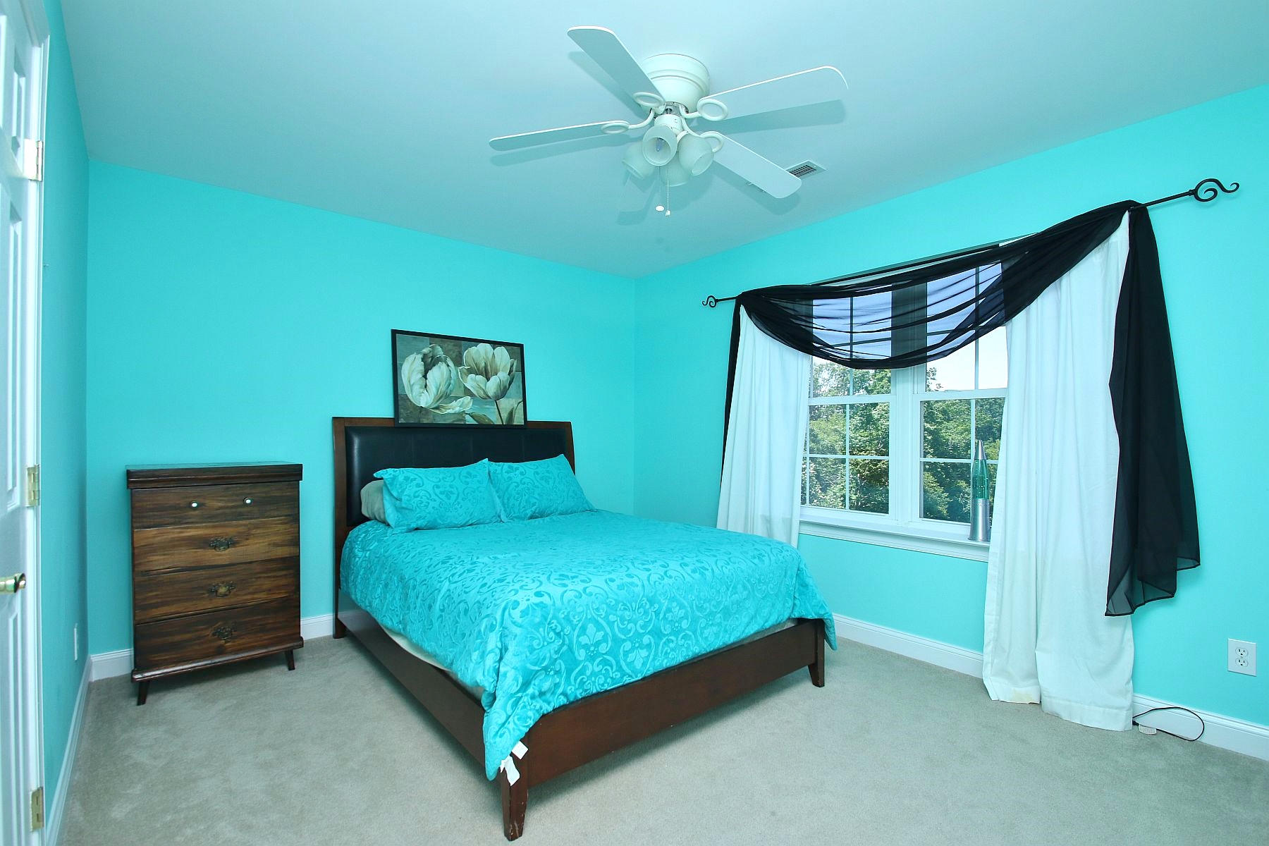 10 Old Point Road Moneta, VA 24121 - Photo 46 of 79 a bedroom with a bed and a flat tv screen on dresser