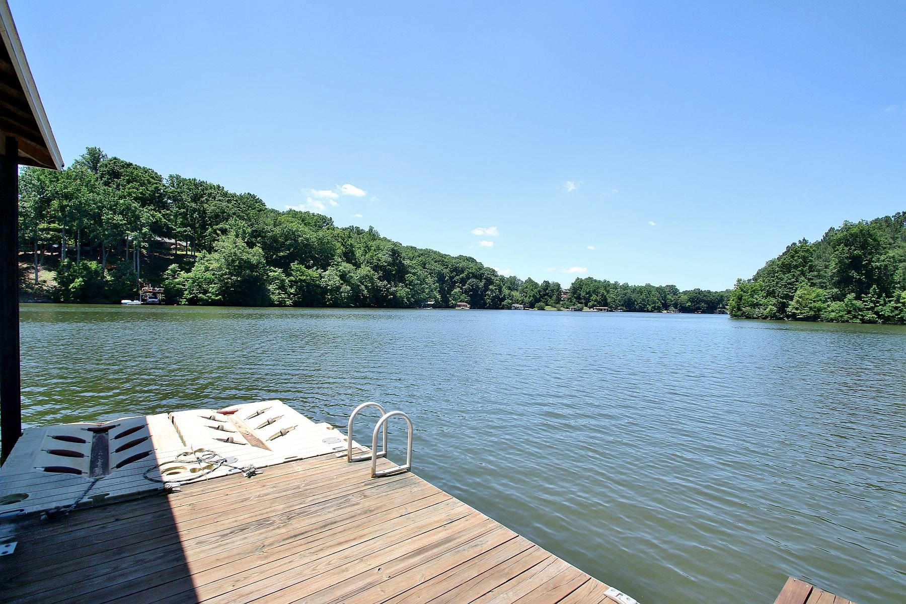 10 Old Point Road Moneta, VA 24121 - Photo 69 of 79 a wooden pier with boats in a lake