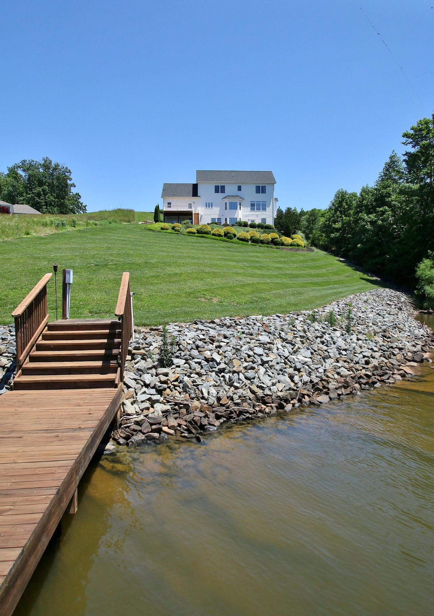 10 Old Point Road Moneta, VA 24121 - Photo 72 of 79 a view of a lake with a big yard