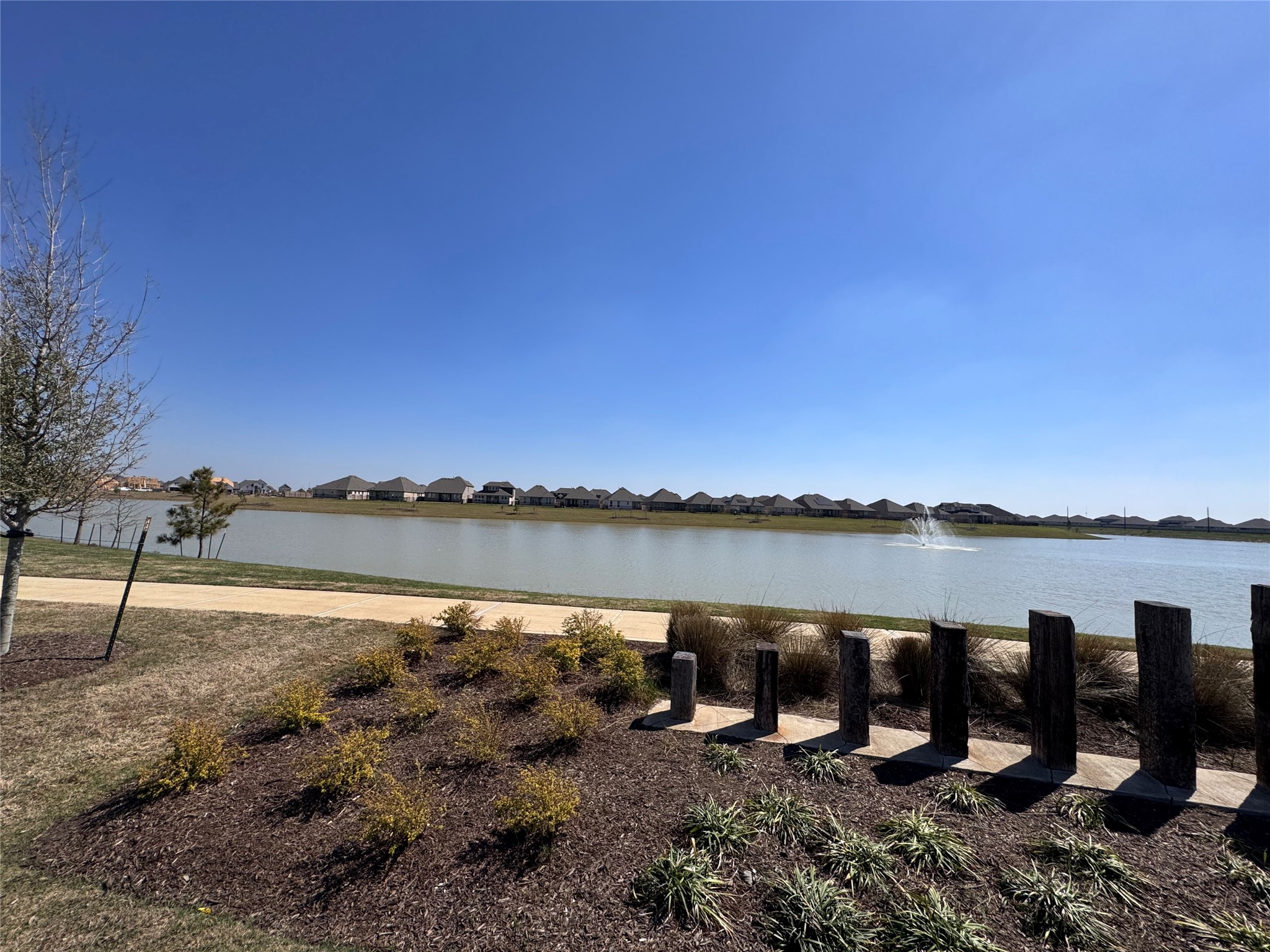 6150 Cherry Ripe Lane Katy, TX 77493 - Photo 17 of 19 a view of a lake from a yard