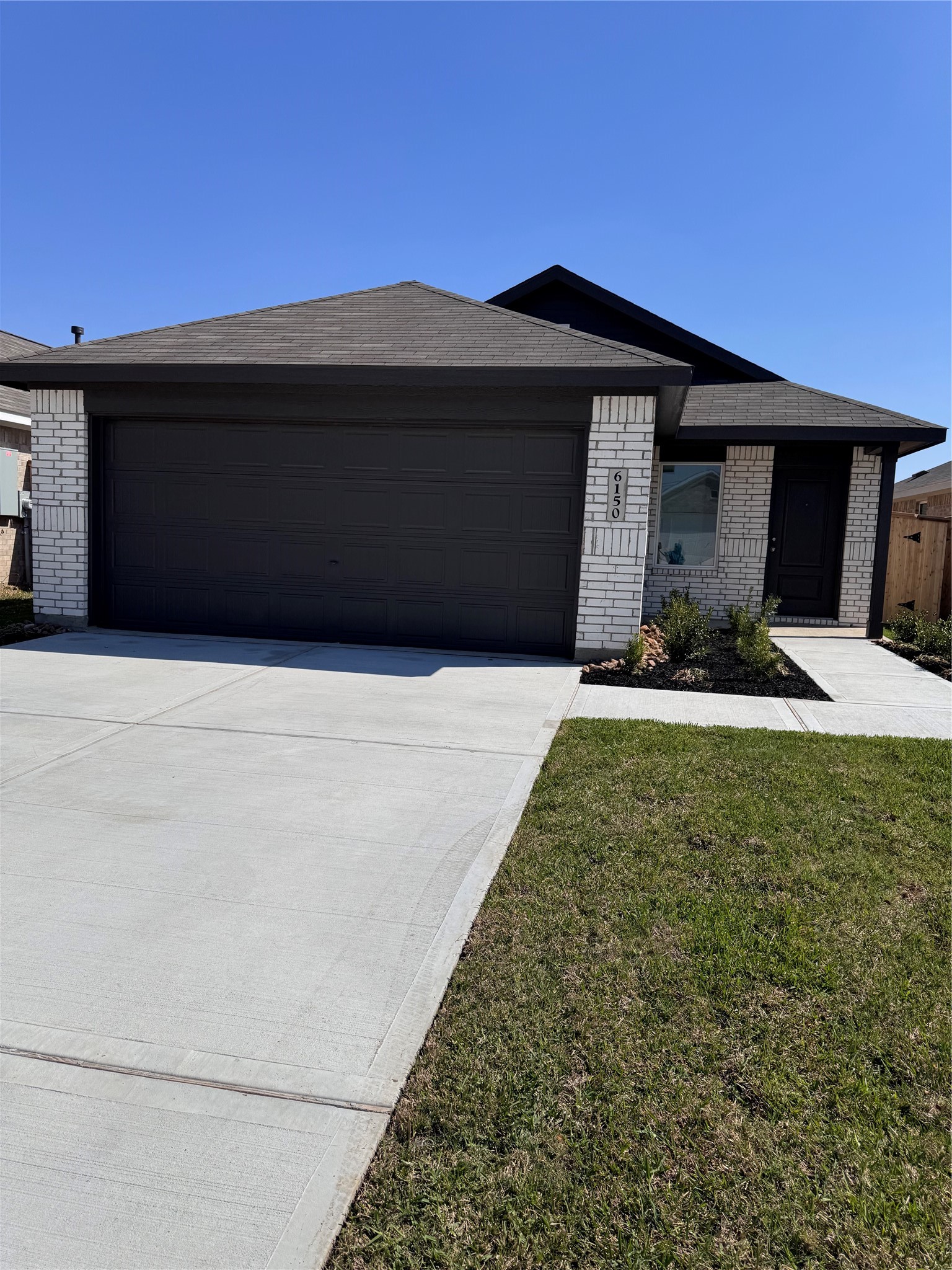 6150 Cherry Ripe Lane Katy, TX 77493 - Photo 2 of 19 a front view of a house with a yard