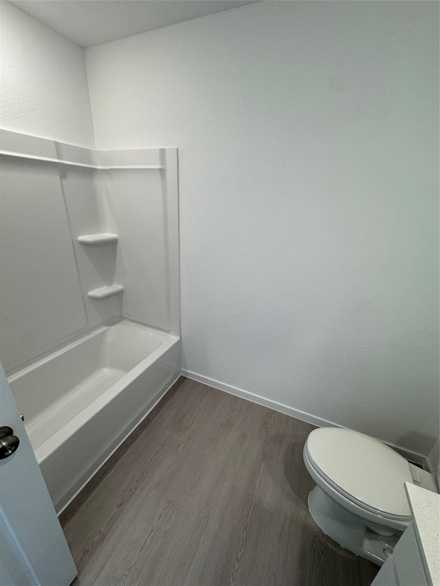 6150 Cherry Ripe Lane Katy, TX 77493 - Photo 5 of 19 a bathroom with a toilet and a bathtub