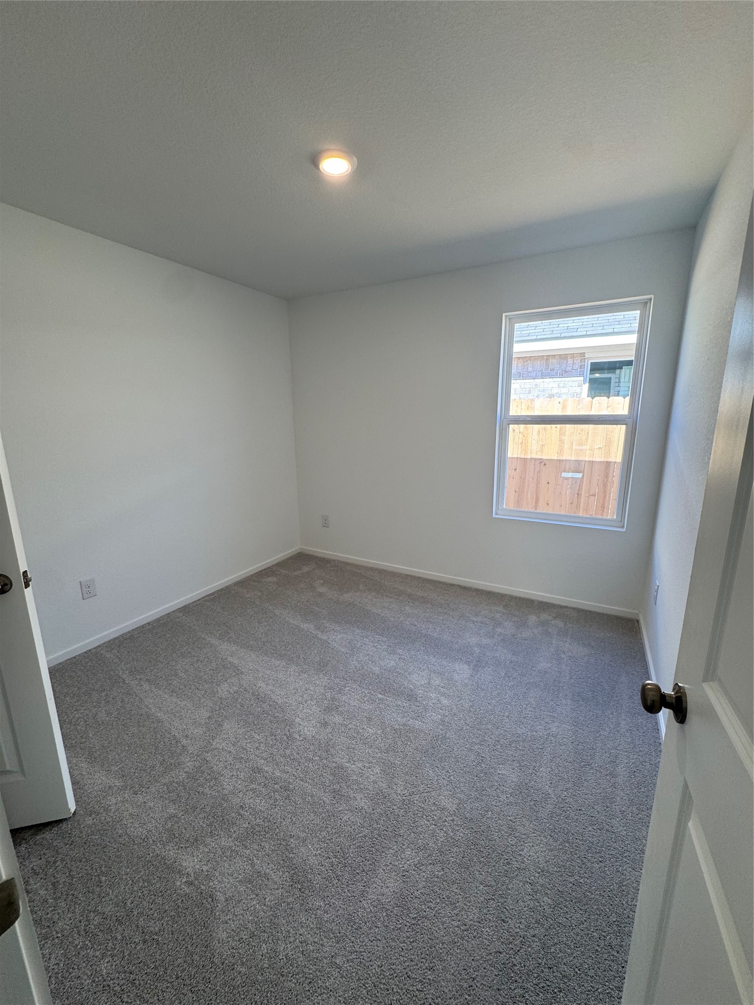 6150 Cherry Ripe Lane Katy, TX 77493 - Photo 6 of 19 an empty room with a window