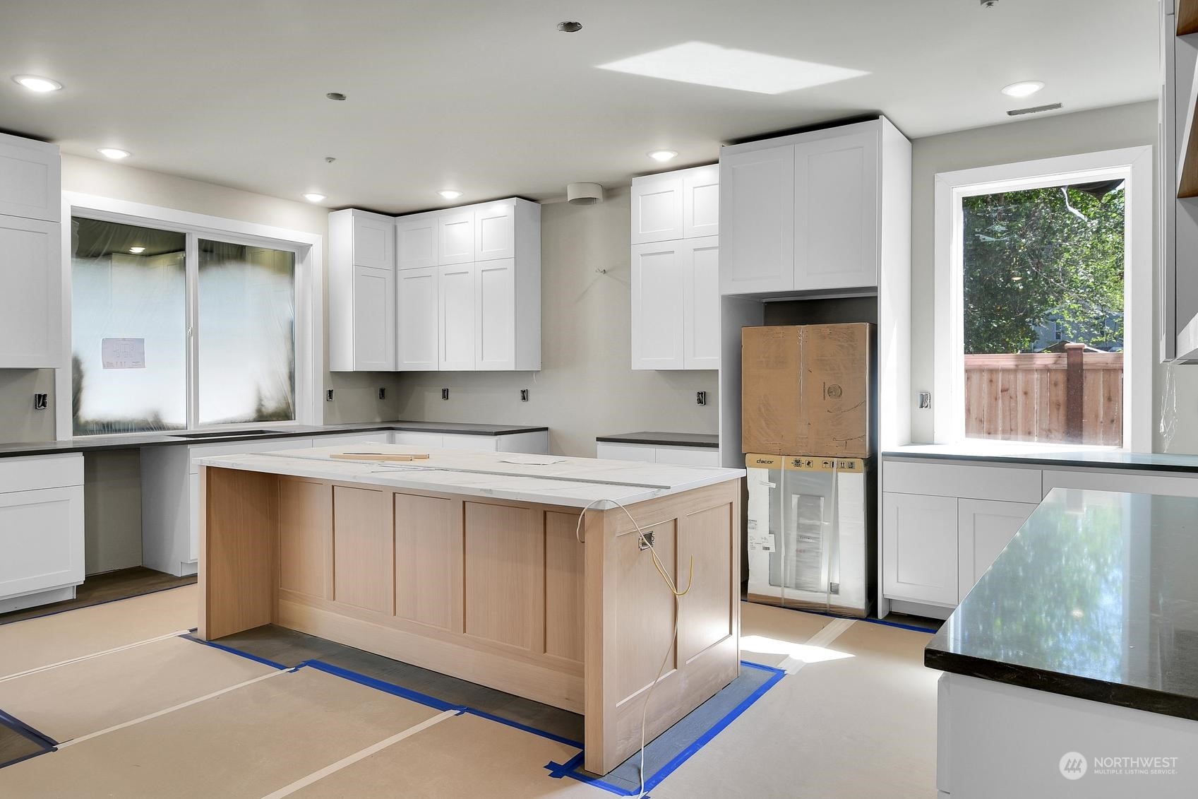 3123 234th Street Southeast Bothell, WA 98021 - Photo 11 of 26 a view of kitchen with stainless steel appliances granite countertop a stove a sink and a refrigerator