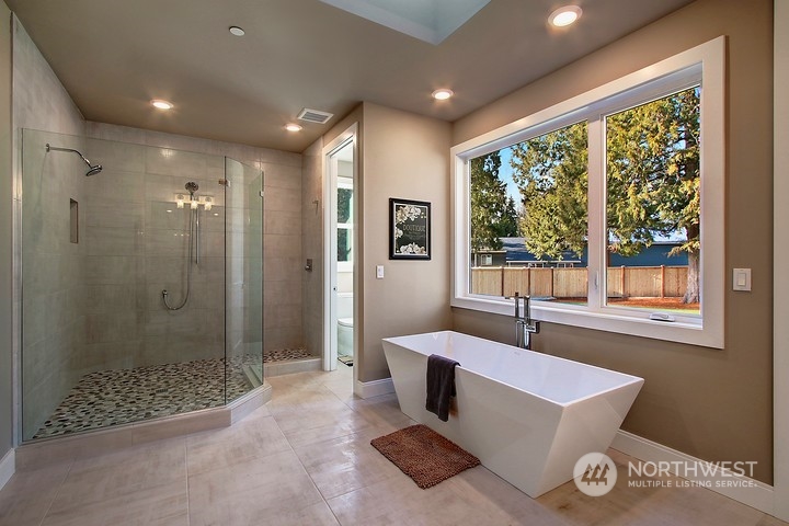3123 234th Street Southeast Bothell, WA 98021 - Photo 6 of 26 a spacious bathroom with a bathtub and shower