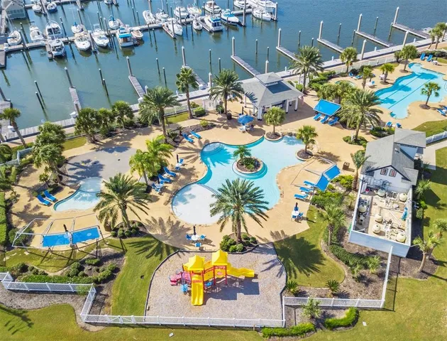 an aerial view of a house with a swimming pool