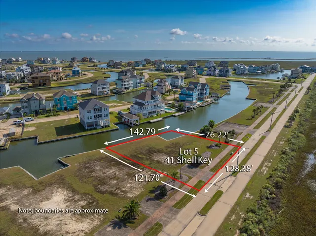a view of a swimming pool with outdoor seating