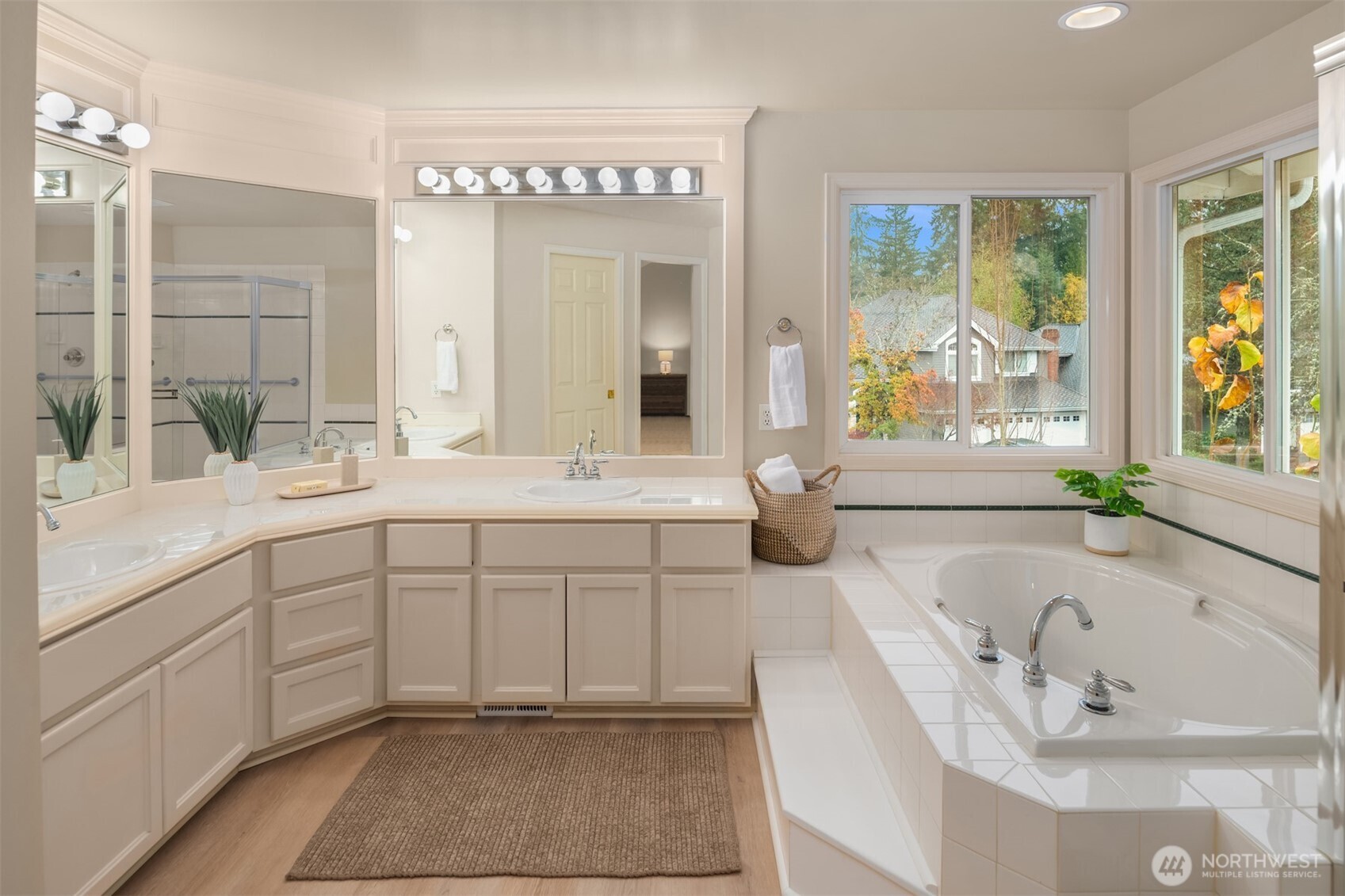 3014 213th Street Southeast Bothell, WA 98021 - Photo 20 of 33 a spacious en suite bathroom with a granite countertop tub and a sink