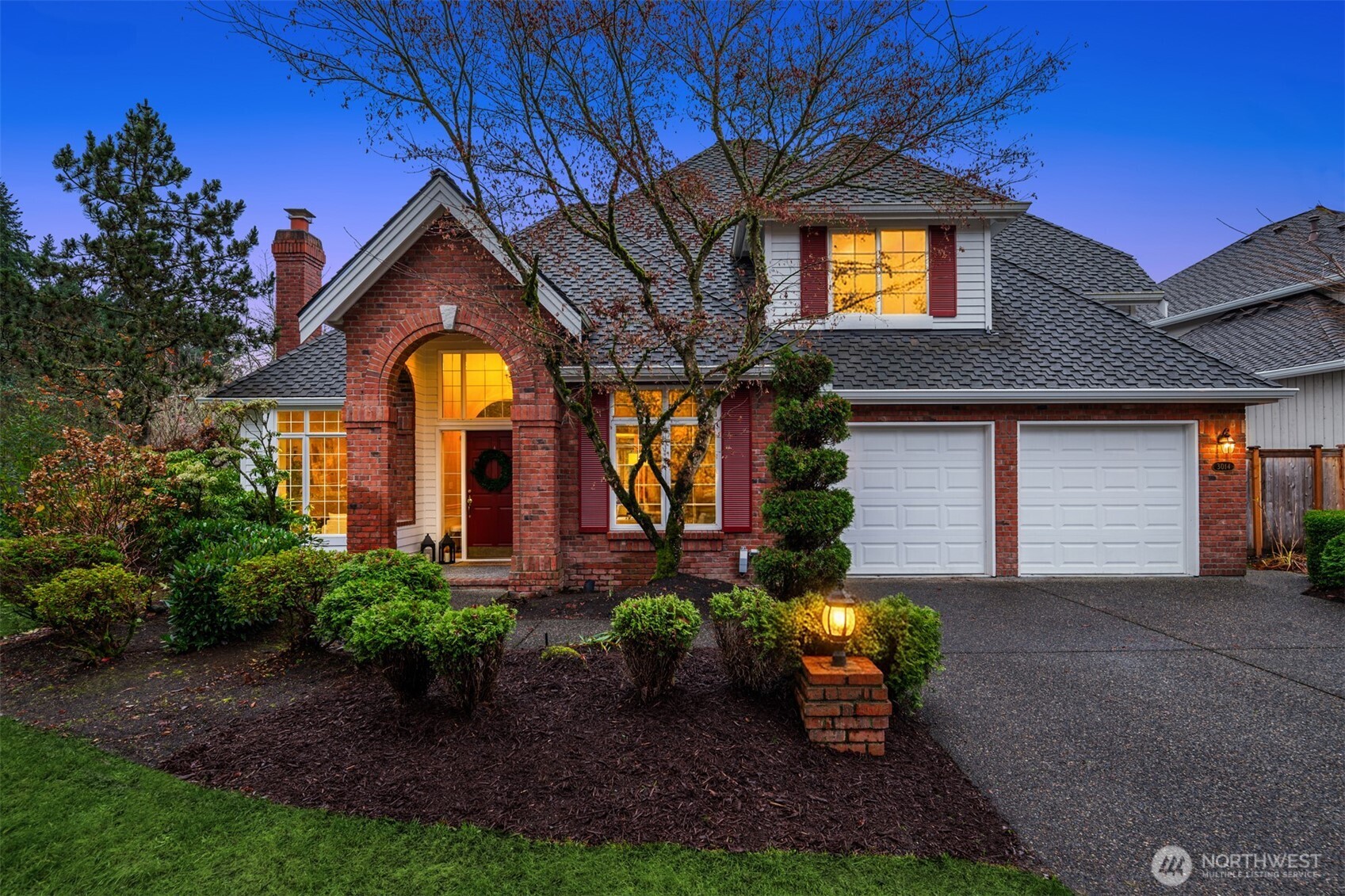 3014 213th Street Southeast Bothell, WA 98021 - Photo 33 of 33 a front view of a house with a yard