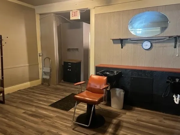 a view of a livingroom with furniture and a table