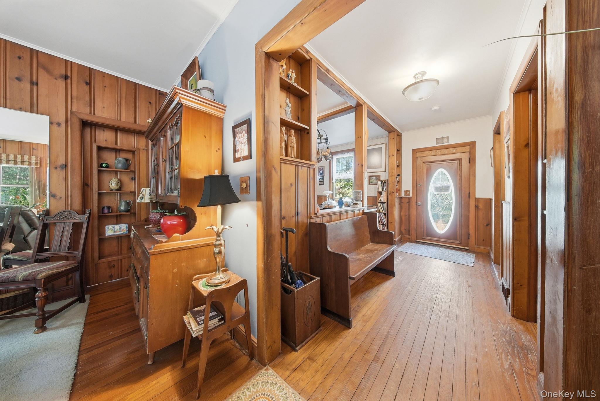 370 Starlight Road Monticello, NY 12701 - Photo 12 of 49 a view of a hallway with wooden floor and furniture