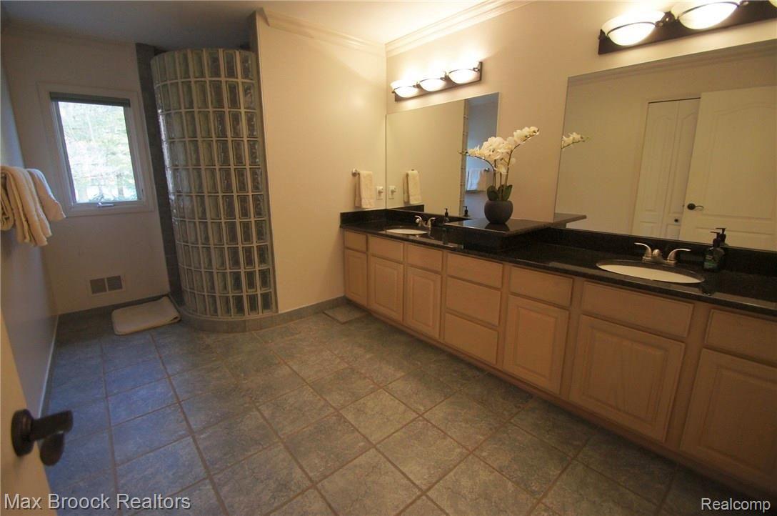 7656 Devins Ridge Clarkston, MI 48348 - Photo 50 of 62 MASTER BATH WITH HIS AND HER SINKS AND GRANITE