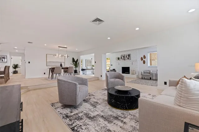 a living room with a couch and a dining table