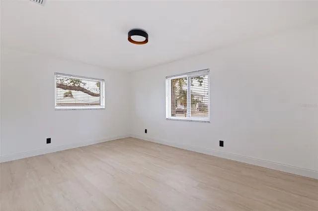 an empty room with windows