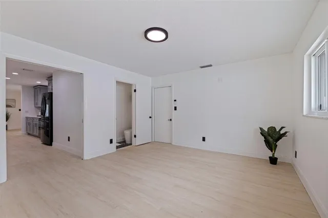 a view of an empty room with a window