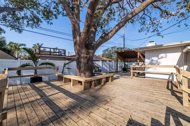 a view of a chairs and table in the patio