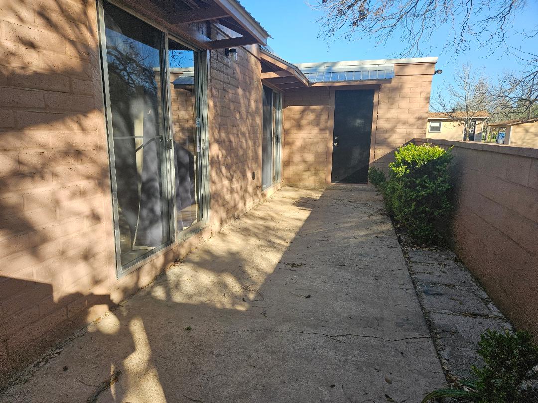410 East 9th Street, Unit C Elgin, TX 78621 - Photo 11 of 11 Side patio with access from both the living room and the bedroom