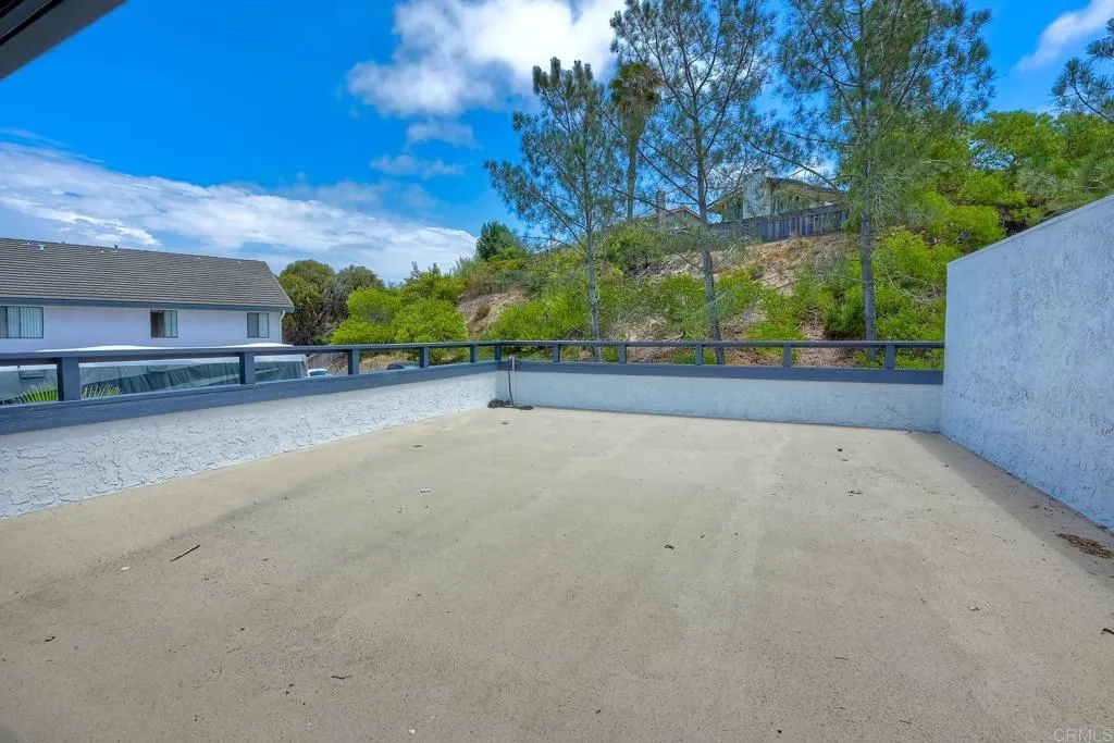 2425 Torrejon Place Carlsbad, CA 92009 - Photo 19 of 61 a view of a patio with a table and chairs