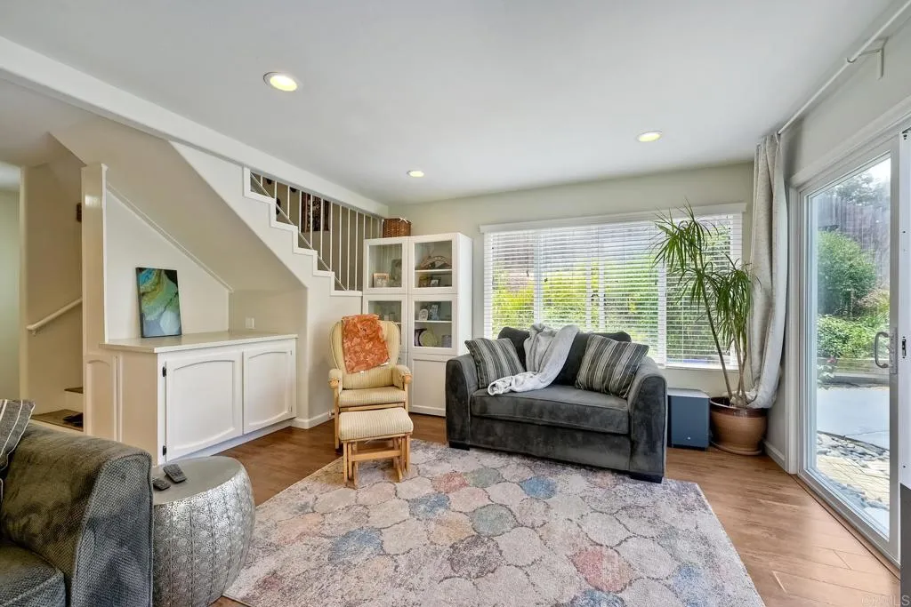 2425 Torrejon Place Carlsbad, CA 92009 - Photo 28 of 61 a living room with furniture and a large window
