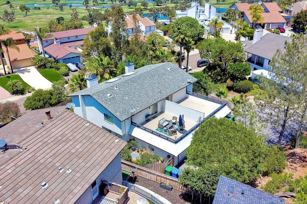 2425 Torrejon Place Carlsbad, CA 92009 - Photo 48 of 61 an aerial view of a house with a yard and lake view