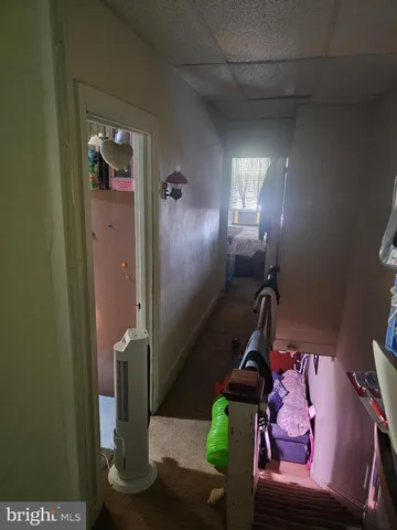 a bedroom with a bed and a mirror