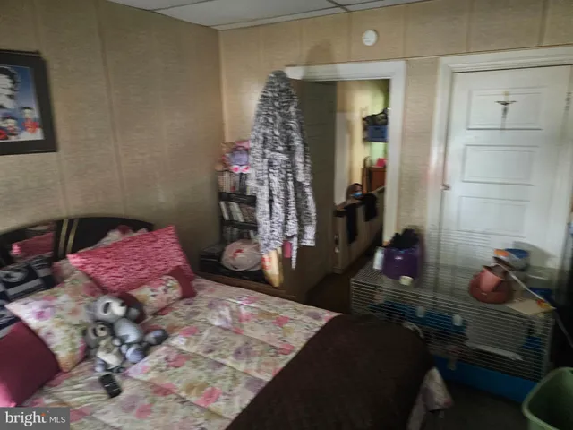 a bed room with a bed window and couch