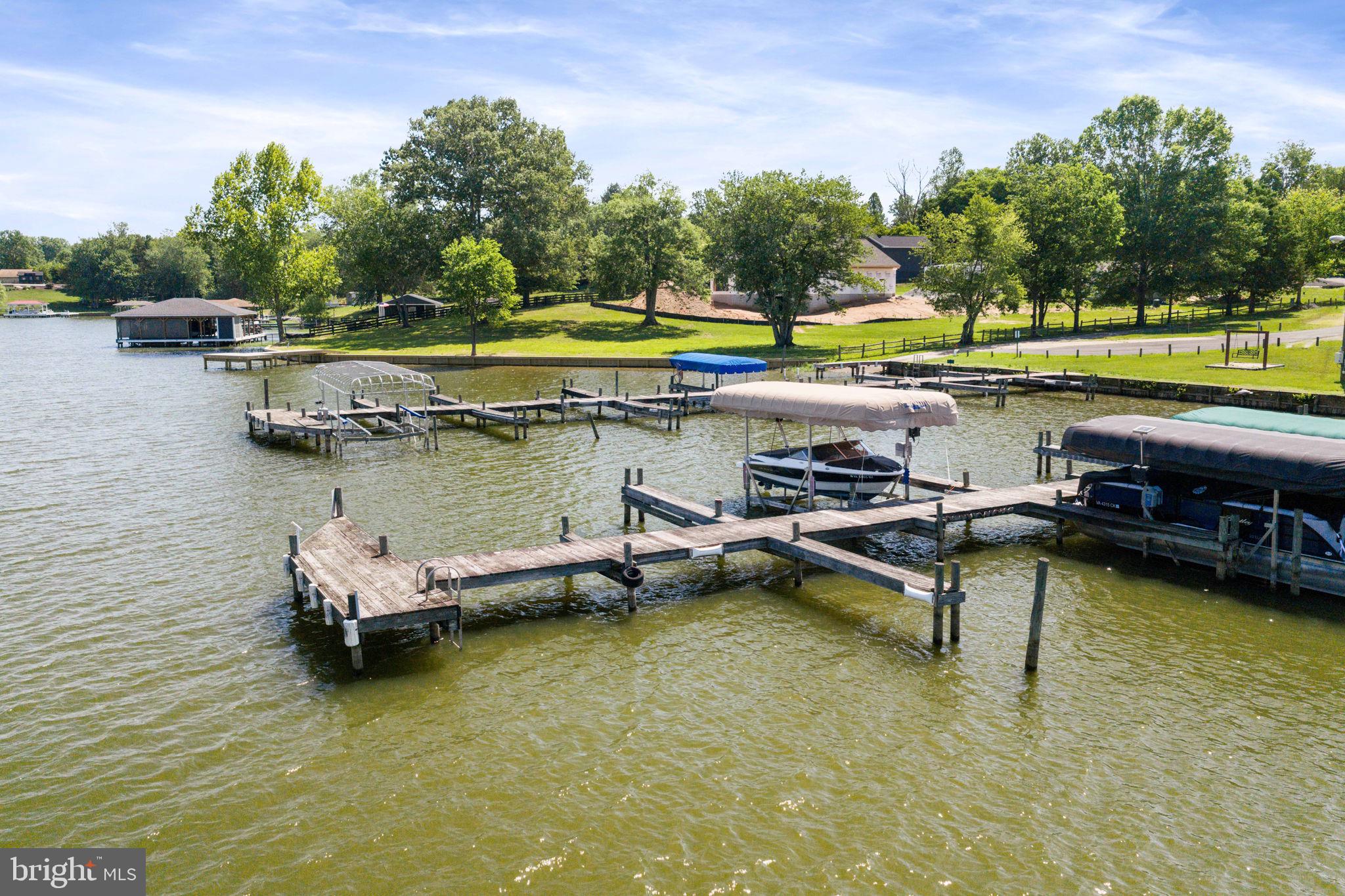 161 Troy Road Louisa, VA 23093 - Photo 53 of 60 a view of a lake with a table and chairs