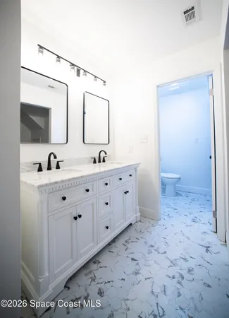 a bathroom with a toilet and a sink