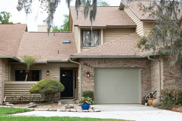 a front view of a house with yard