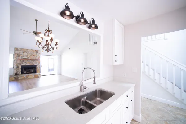 a view of fireplace and a wooden floor