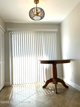 a room with a sink dishwasher and a wooden floor