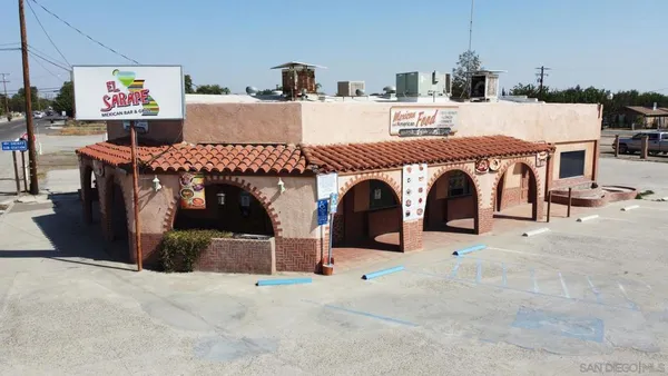 a view of livingroom with fireplace and furniture