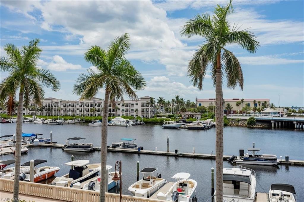 451 Bayfront Place, Unit 5207 Naples, FL 34102 - Photo 22 of 35 a front view of a house with lake view and a floor to ceiling window