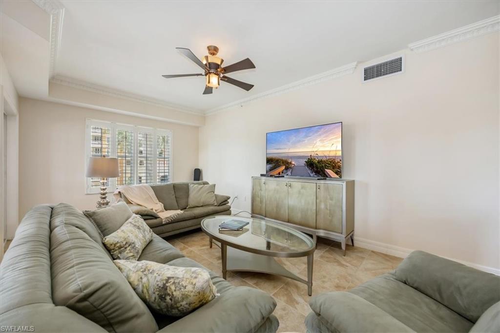 451 Bayfront Place, Unit 5207 Naples, FL 34102 - Photo 3 of 35 a living room with furniture and a flat screen tv