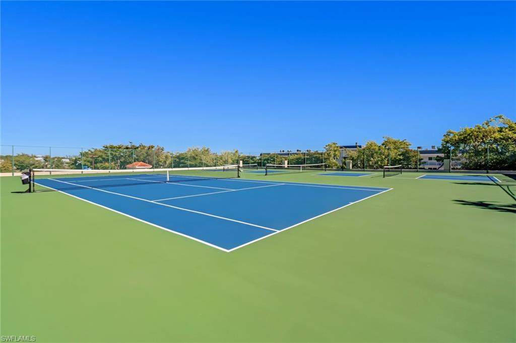 451 Bayfront Place, Unit 5207 Naples, FL 34102 - Photo 31 of 35 a view of an outdoor space and tennis court