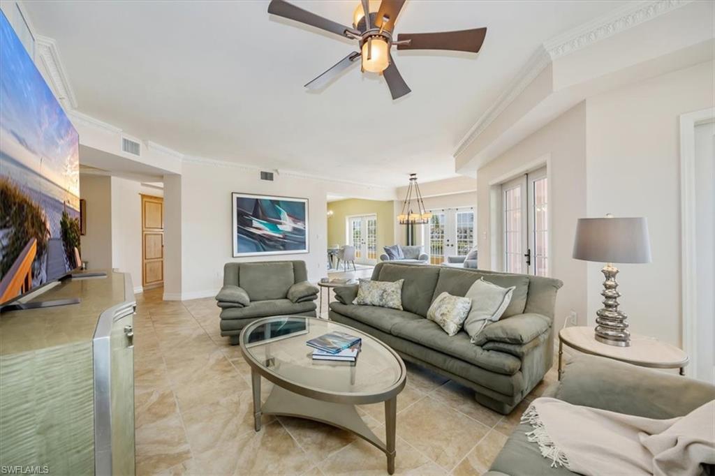 451 Bayfront Place, Unit 5207 Naples, FL 34102 - Photo 4 of 35 a living room with furniture and a flat screen tv