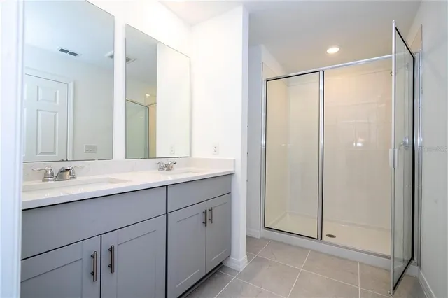 a bathroom with a shower and a sink
