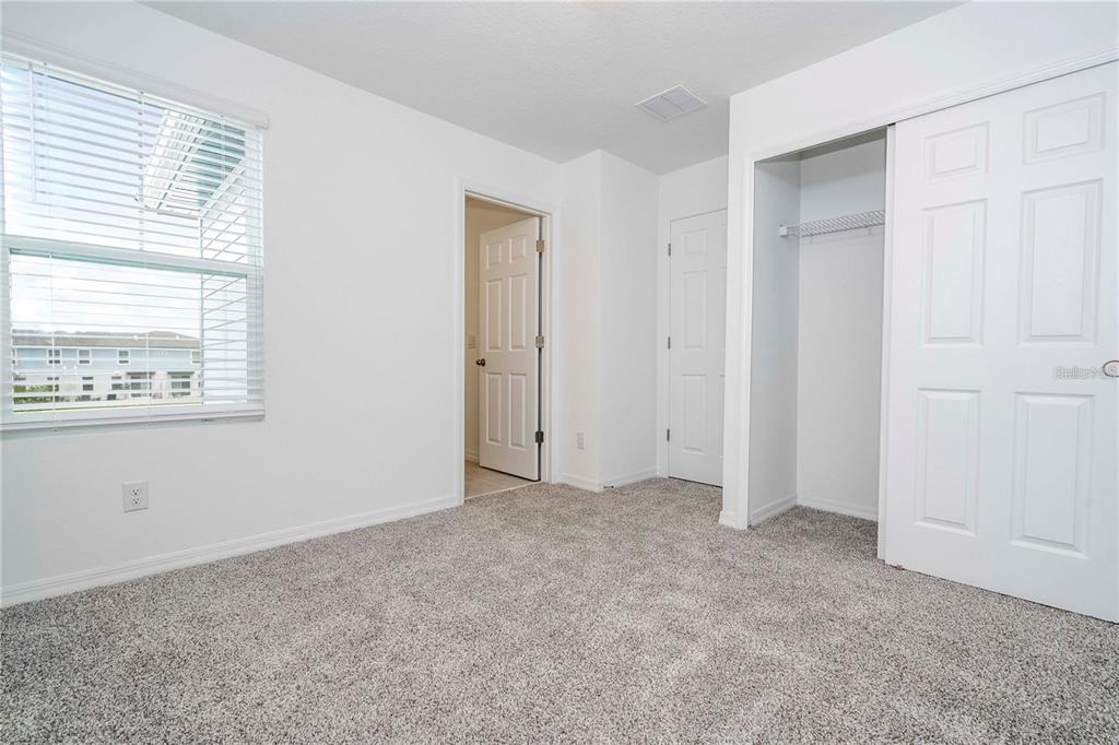 4549 Burrowing Owl Loop St. Cloud, FL 34772 - Photo 37 of 48 a view of an empty room with a window