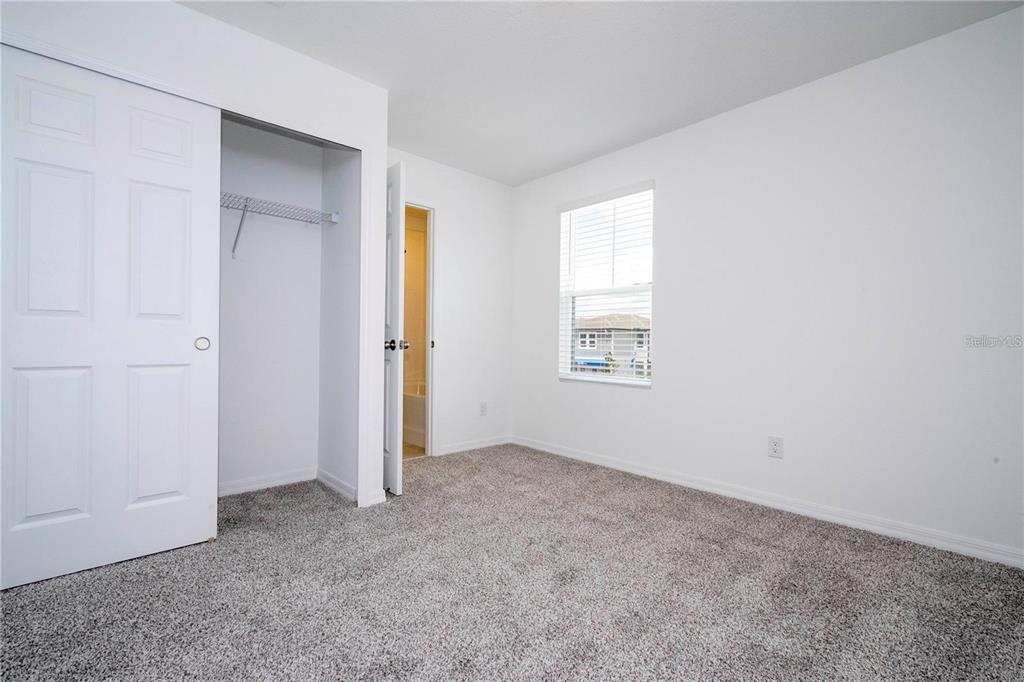 4549 Burrowing Owl Loop St. Cloud, FL 34772 - Photo 41 of 48 an empty room with windows