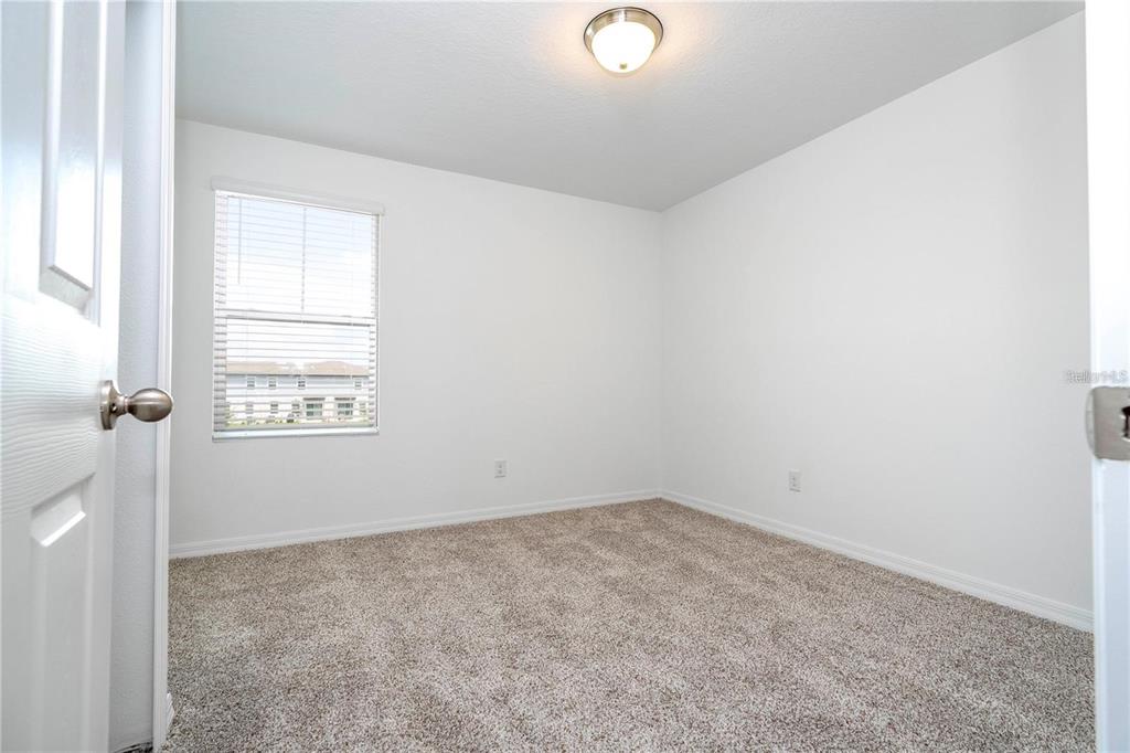 4549 Burrowing Owl Loop St. Cloud, FL 34772 - Photo 43 of 48 an empty room with a window