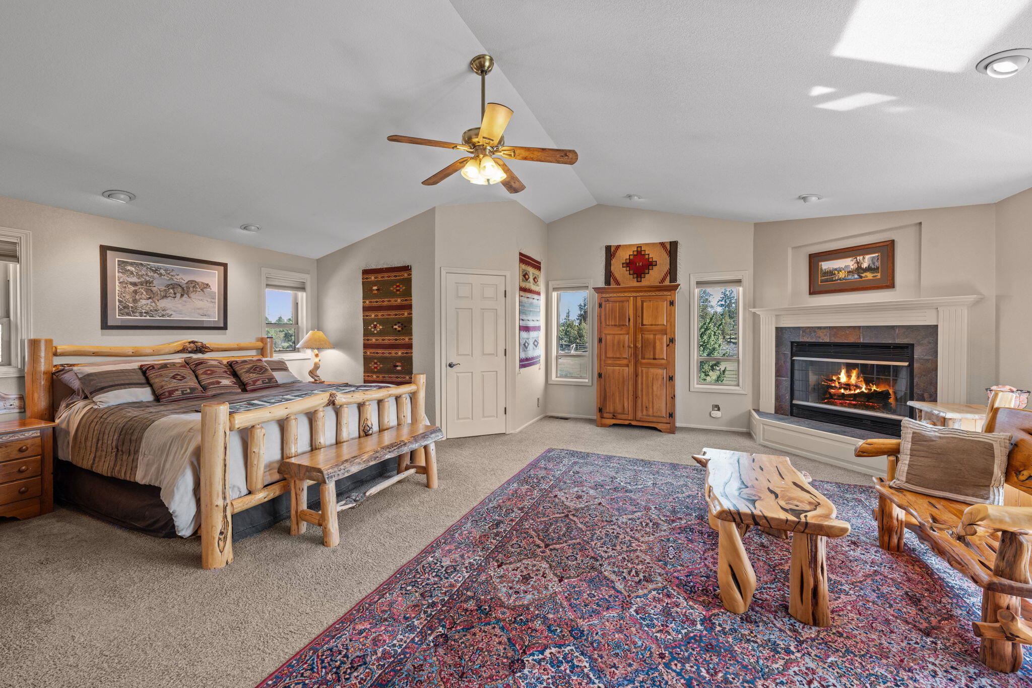 17375 Jordan Road Sisters, OR 97759 - Photo 30 of 63 Large primary bedroom on the main level with two walk-in closets and propane fireplace.
