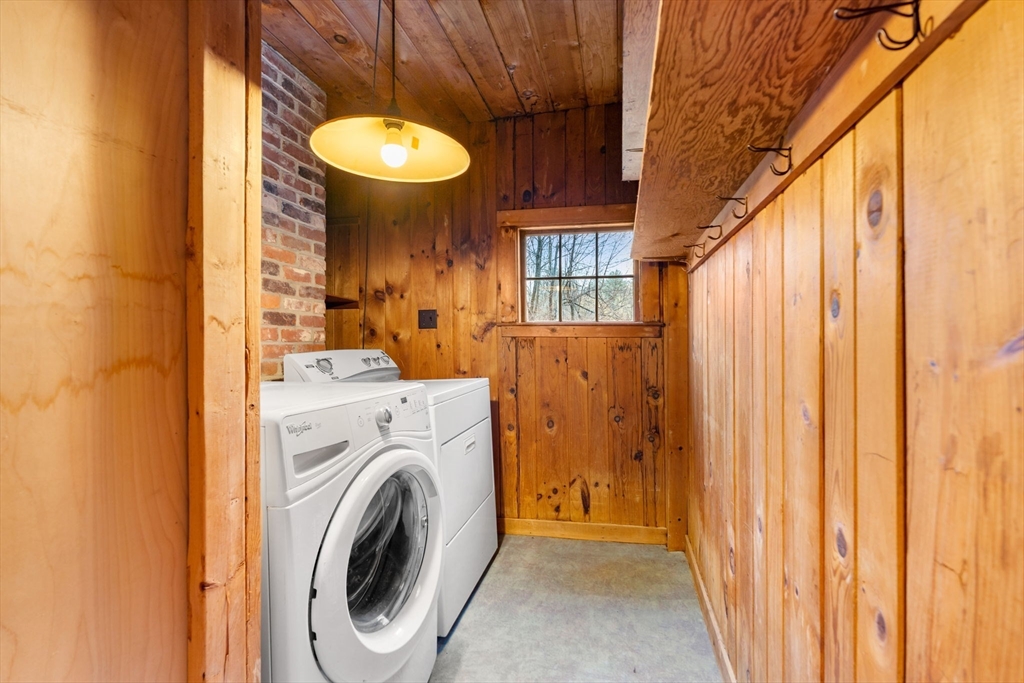 104 Mill Street Groton, MA 01450 - Photo 11 of 30 a view of a room with washer and dryer