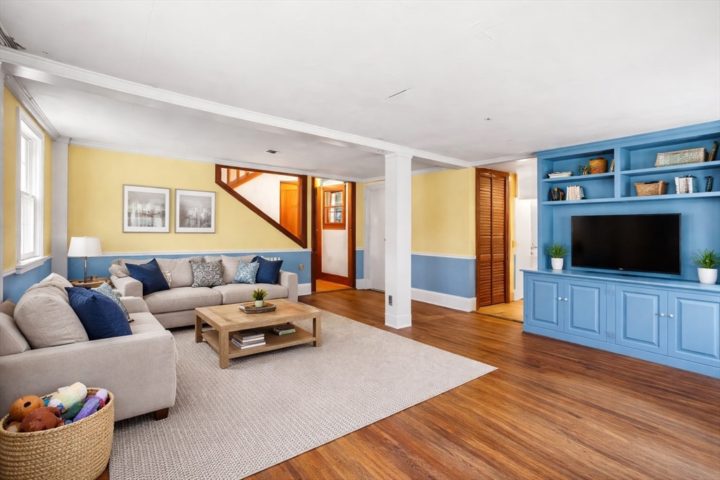 104 Mill Street Groton, MA 01450 - Photo 17 of 30 a living room with furniture and a flat screen tv