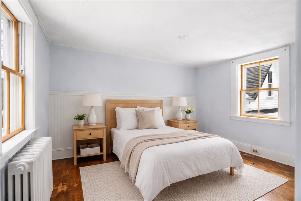 104 Mill Street Groton, MA 01450 - Photo 20 of 30 a bedroom with a bed and a window