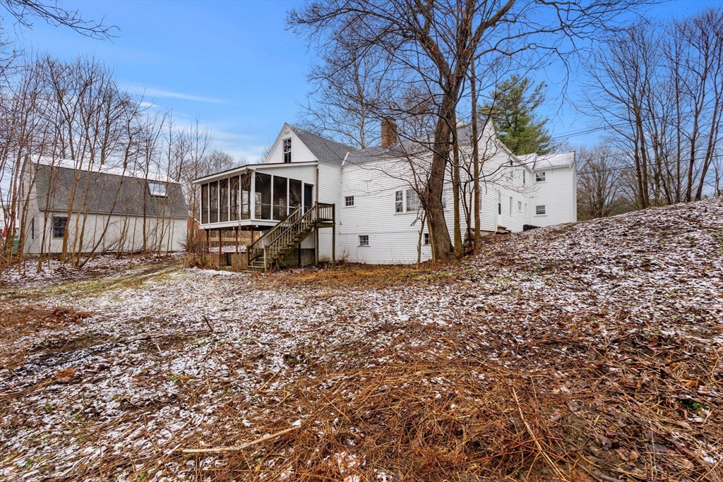 104 Mill Street Groton, MA 01450 - Photo 2 of 30 a front view of a house with a yard