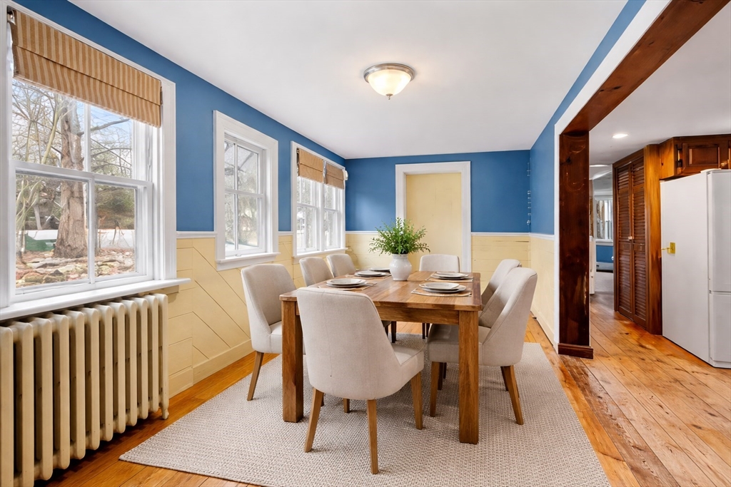 104 Mill Street Groton, MA 01450 - Photo 4 of 30 a view of a dining room with furniture window and outside view