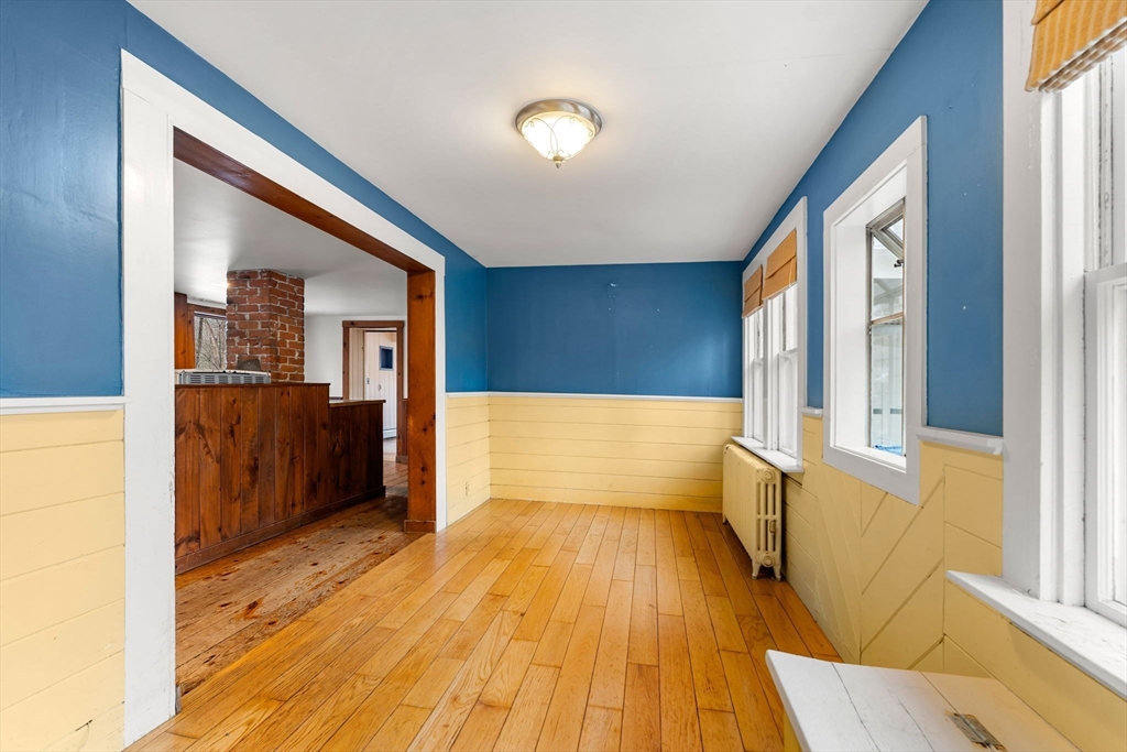 104 Mill Street Groton, MA 01450 - Photo 5 of 30 a view of hallway with wooden floor and furniture