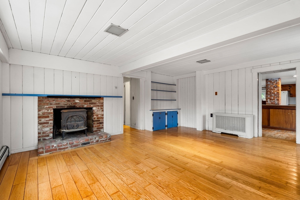 104 Mill Street Groton, MA 01450 - Photo 10 of 30 a living room with furniture and a fireplace