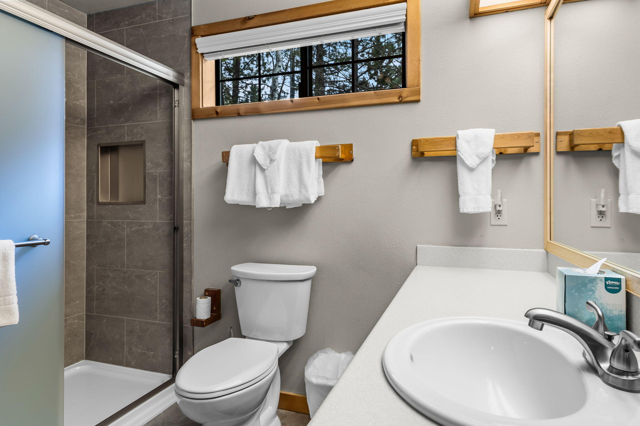 57505 Circle 4 Cabin Road, Unit 29 Sunriver, OR 97707 - Photo 26 of 35 a bathroom with a sink a toilet and shower